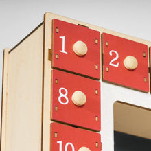 Laden Sie das Bild in den Galerie-Viewer, Adventskalender mit Dorfszene, 24 große Schubladen, 34 x 7 x 34 cm, Rot